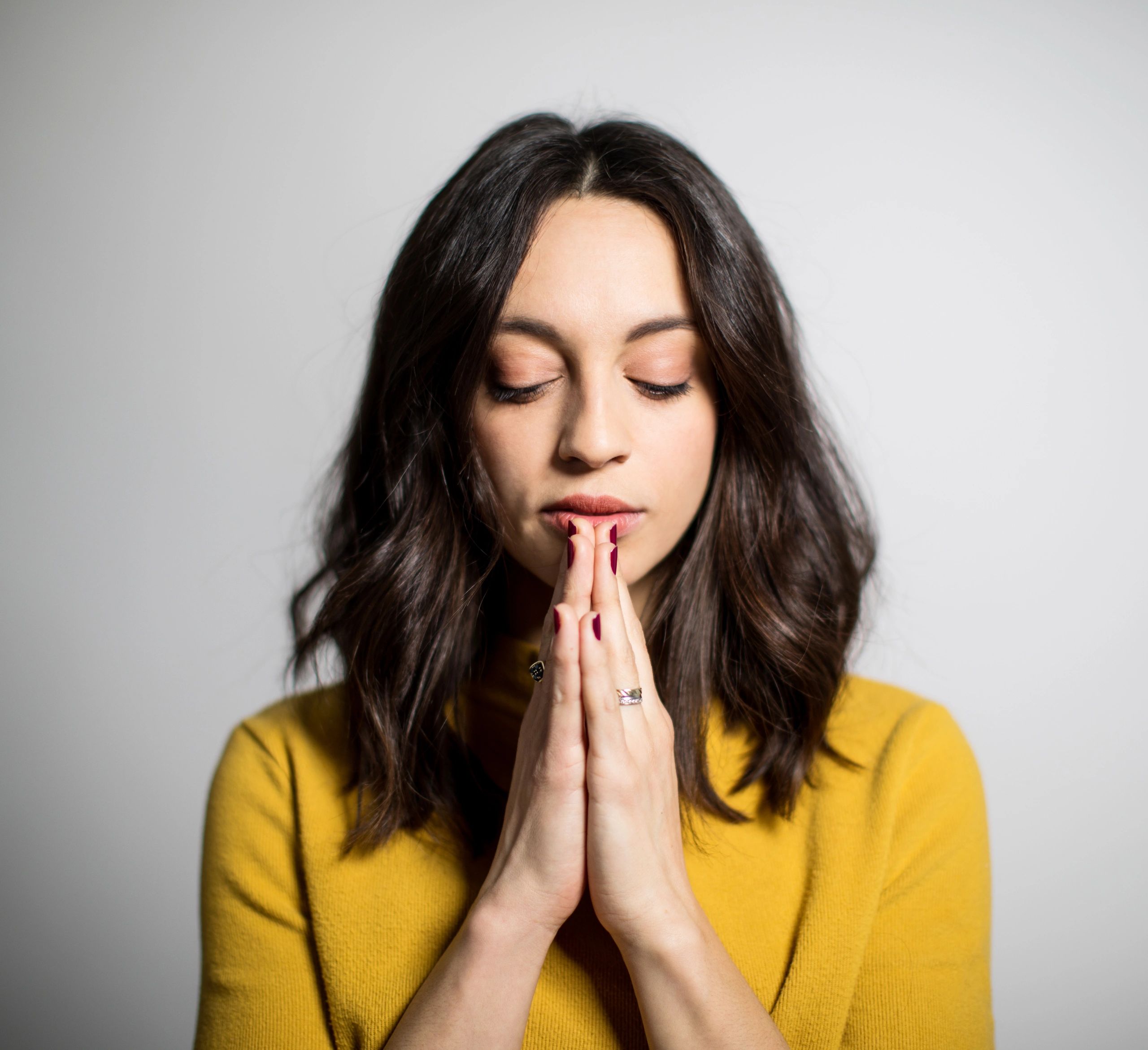 Thoughtful woman with eyes closed in reflection