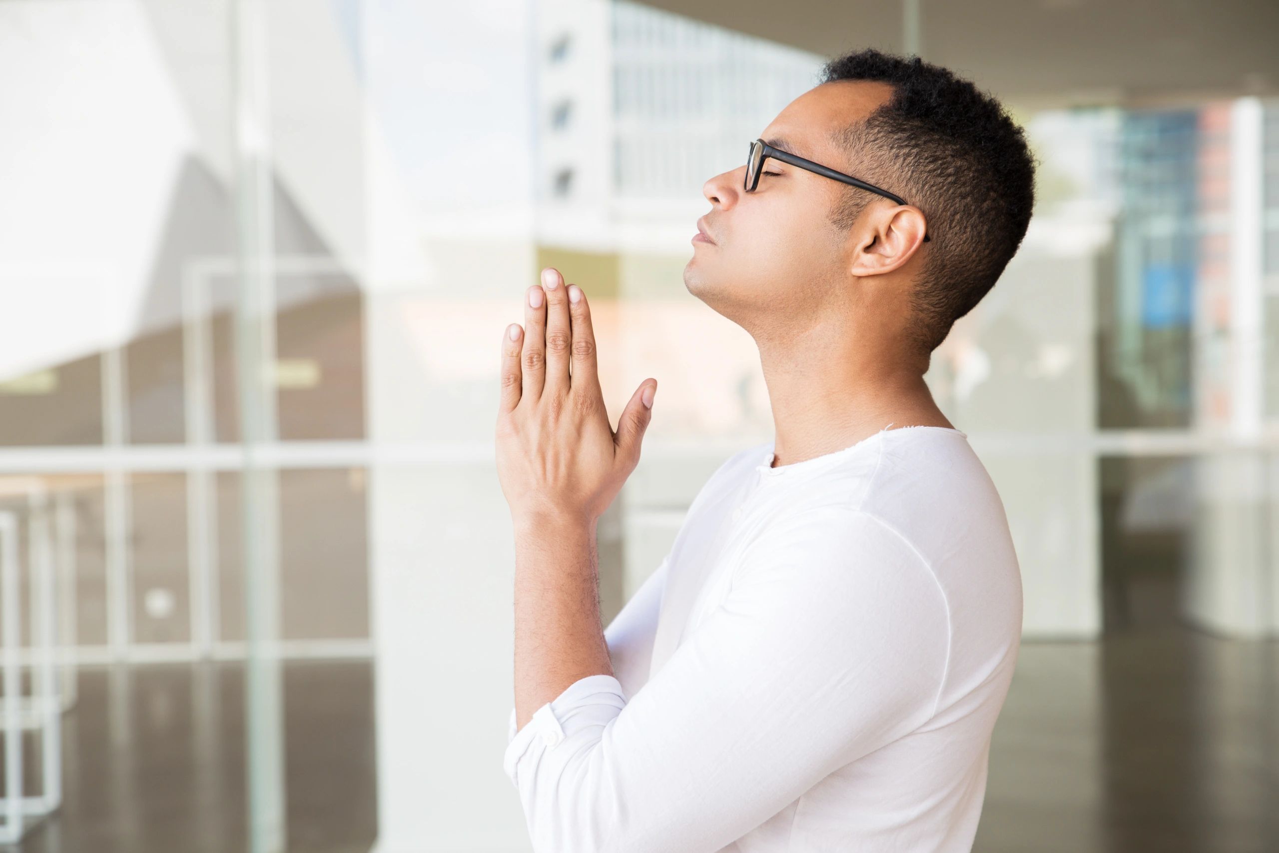 Man praying during Bible study