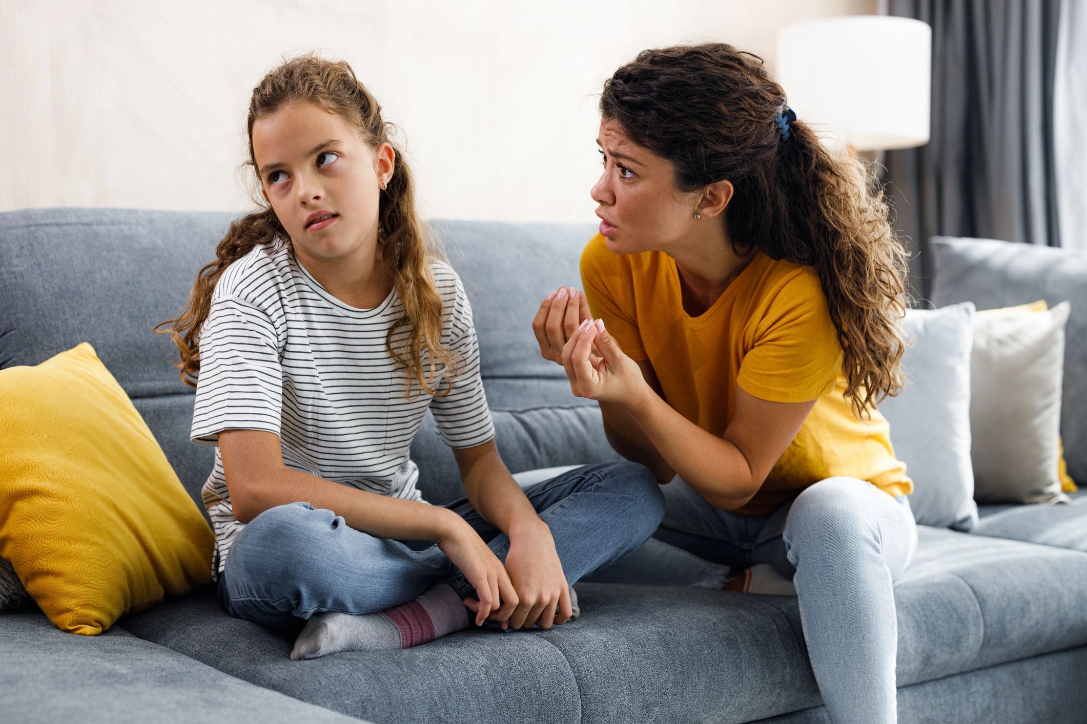 Two people in a serious supportive conversation at home
