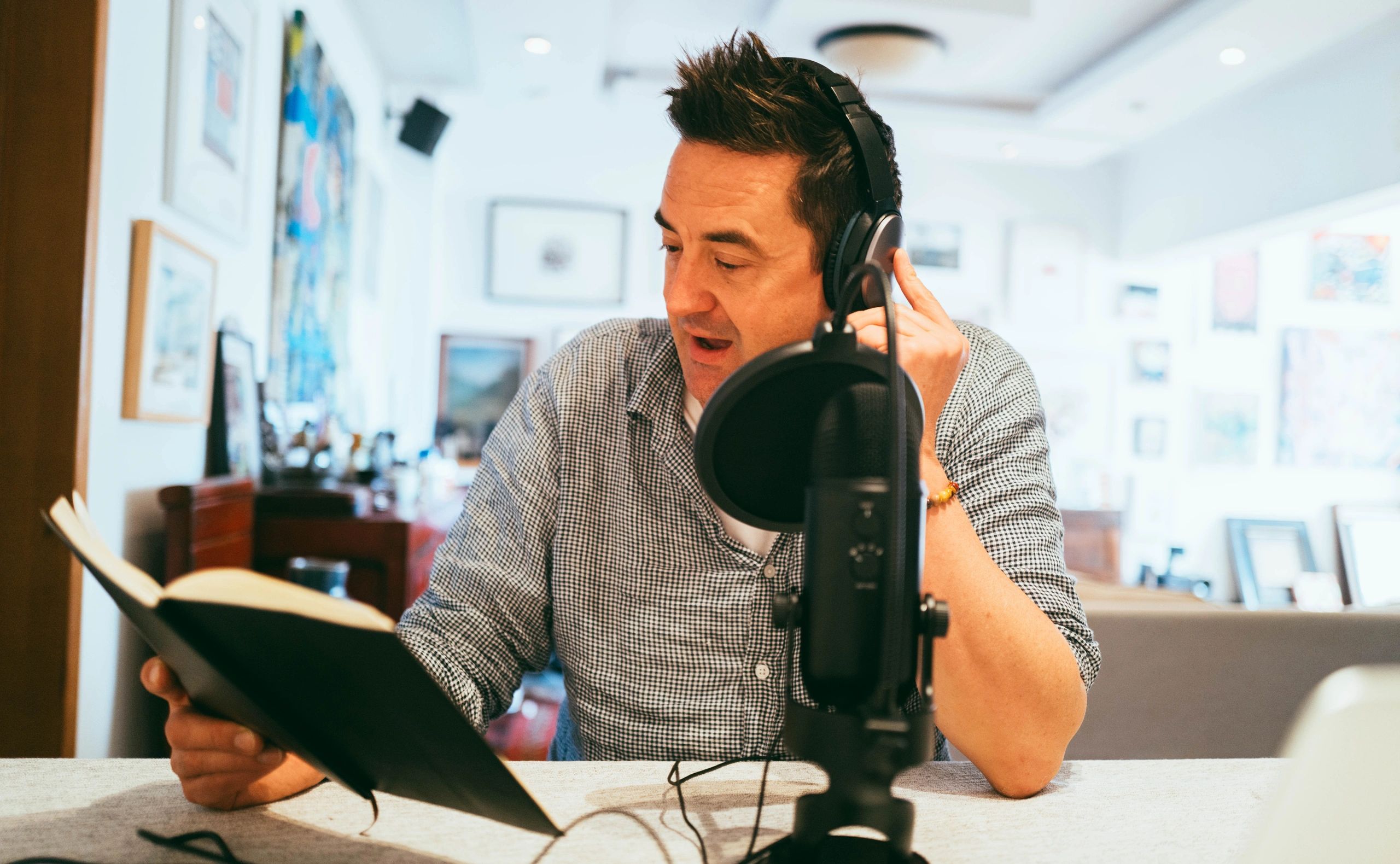 Reverend recording Christian podcast content in a studio