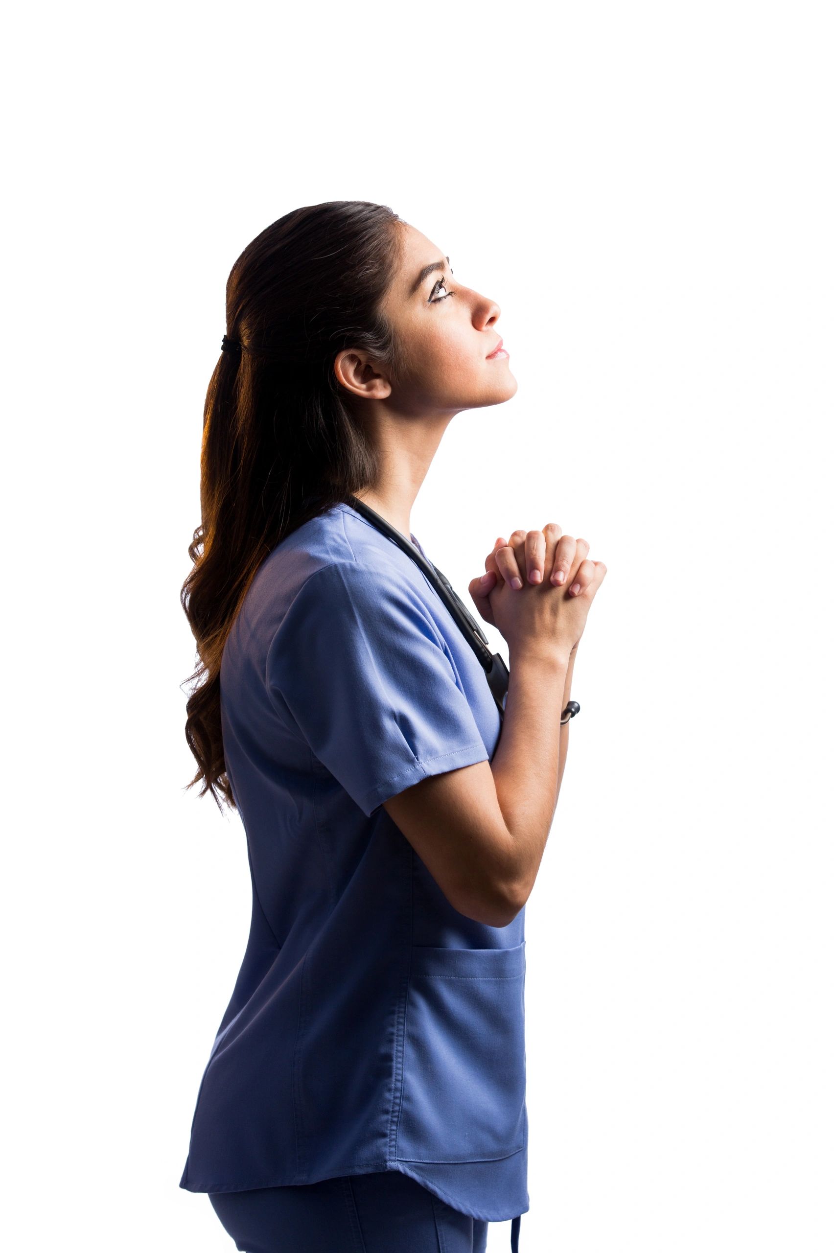 Woman praying with hands clasped and looking upward